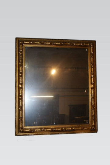 Large symmetrical mirror from the mid-1800s in gold