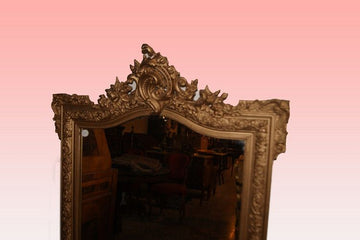 Louis XVI style mirror with gold leaf gilded wooden frame