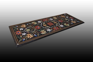 Antique black marble table with semi-precious stone flowers inlays