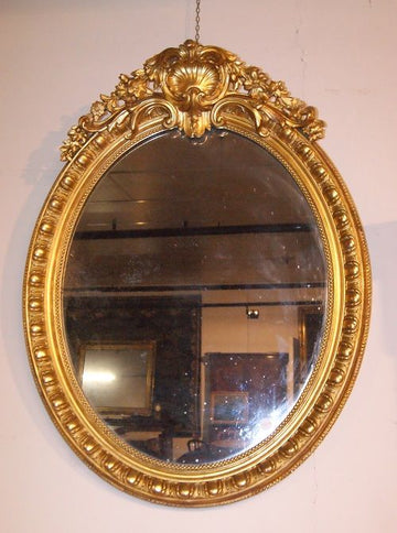 French vertical oval mirror with cymatium