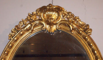 French vertical oval mirror with cymatium