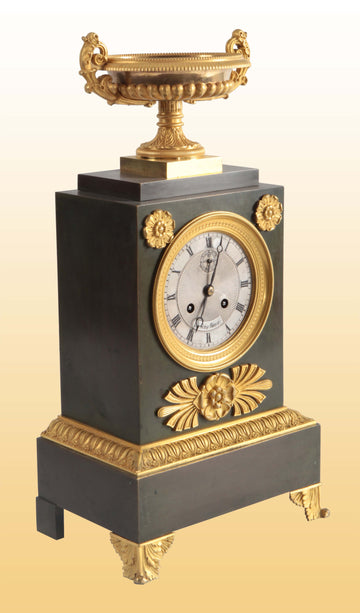 Antique French mantel clock from the 1800s in metal with Empire gilt bronzes