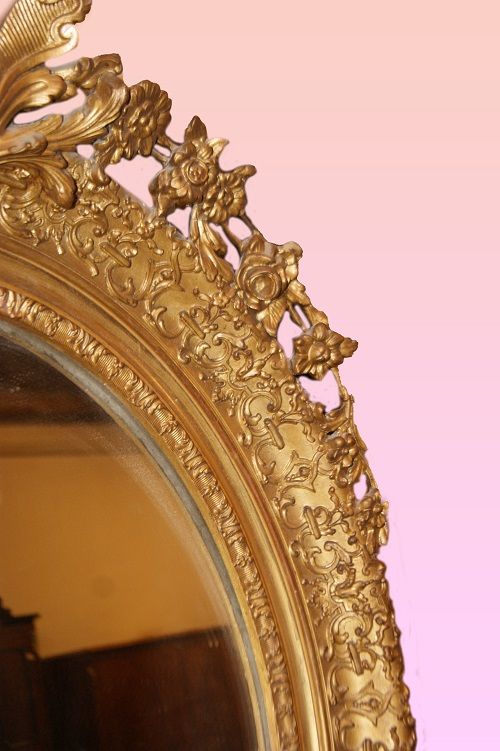 Antica specchiera ovale dorata foglia oro con cimasa stile Luigi XV