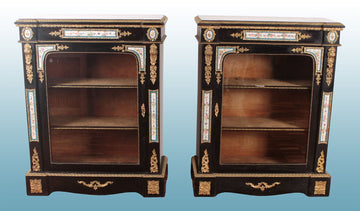 Pair of ebony sideboards with Sevres porcelain medallions