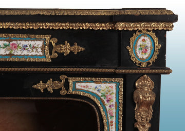 Pair of ebony sideboards with Sevres porcelain medallions