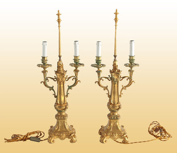 Pair of antique electrified two-light candlesticks in gilded bronze