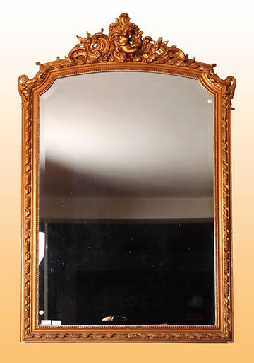French mirror with rich cymatium and cherub