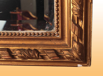 French mirror with rich cymatium and cherub
