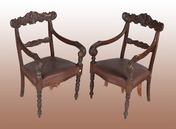 Poltrone francesi del 1800 con ricchi motivi di intaglio