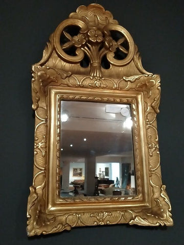 Specchiera italiana in legno dorato ed intagliato