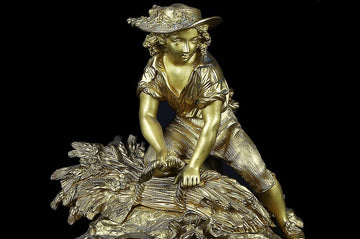 Orologio parigina  in bronzo e metallo dorato