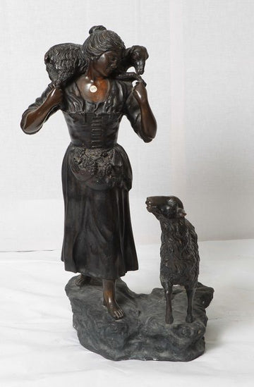 Antique French metal statue from the 1800s depicting a shepherdess