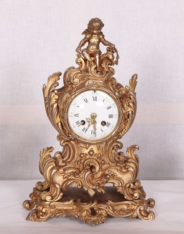 Antique French Louis XV bronze candlestick mantel clock from 1800