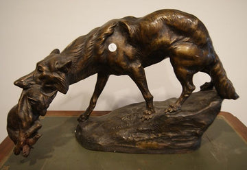 She-wolf with cub in her mouth sculpture signed Thomas François Cartier