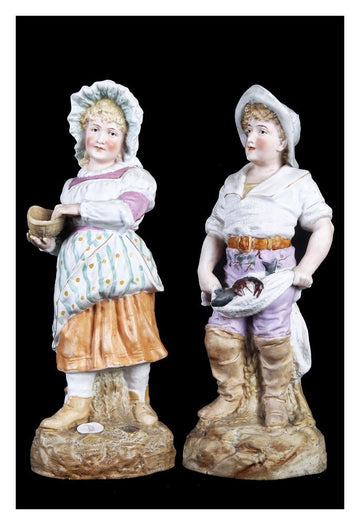 Coppia di statuine in porcellana decorata inglese