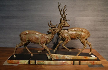 Antique Art Deco style metal sculpture depicting deer with marble base