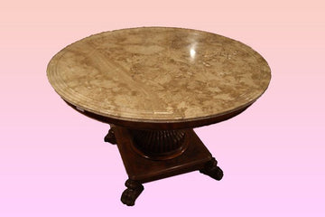 Antique Charles X center table from 1800 in mahogany with marble