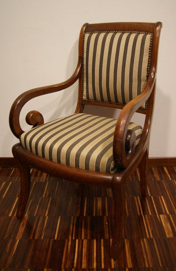 an Antique French armchair from the 1800s Directory in mahogany