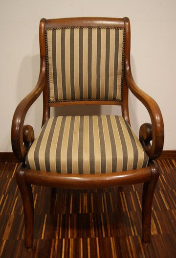 an Antique French armchair from the 1800s Directory in mahogany