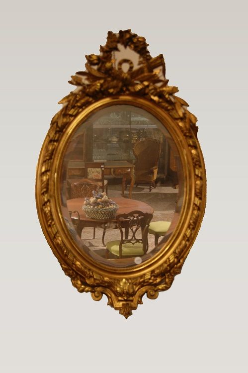 Specchiera ovale del 1800 con cimasa foglia oro