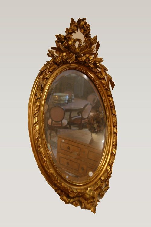 Specchiera ovale del 1800 con cimasa foglia oro