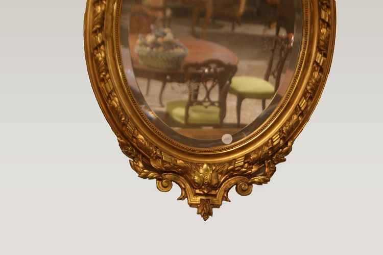 Specchiera ovale del 1800 con cimasa foglia oro