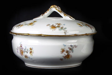 Limoges porcelain table service decorated with floral motifs