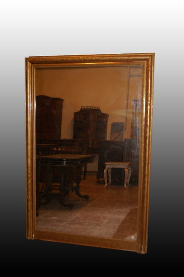 Large French Louis XVI style mirror in gilded wood