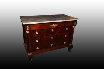 French Empire style chest of drawers in mahogany wood with rich bronzes and marble top