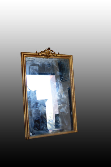 French gilded mirror from the 1800s in Louis XVI style with cymatium