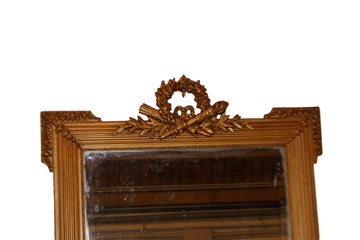 French Louis XVI style mirror in gold leaf gilded wood