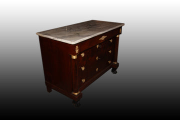 French Empire style chest of drawers in mahogany wood with rich bronzes and marble top